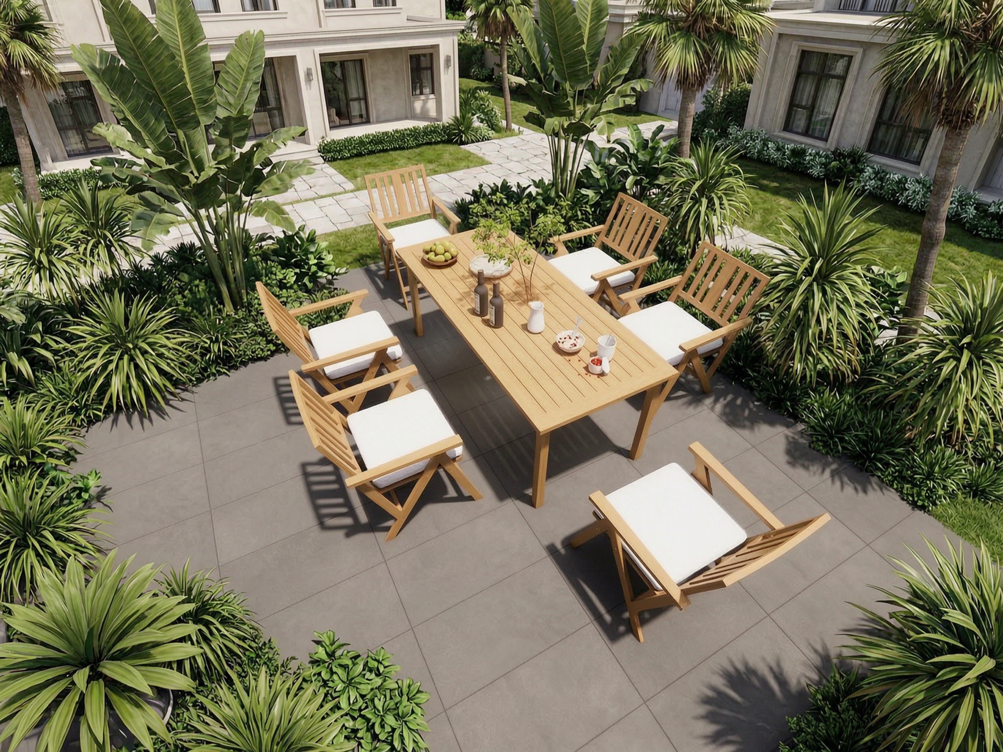 Light teak dining collection in a garden setting