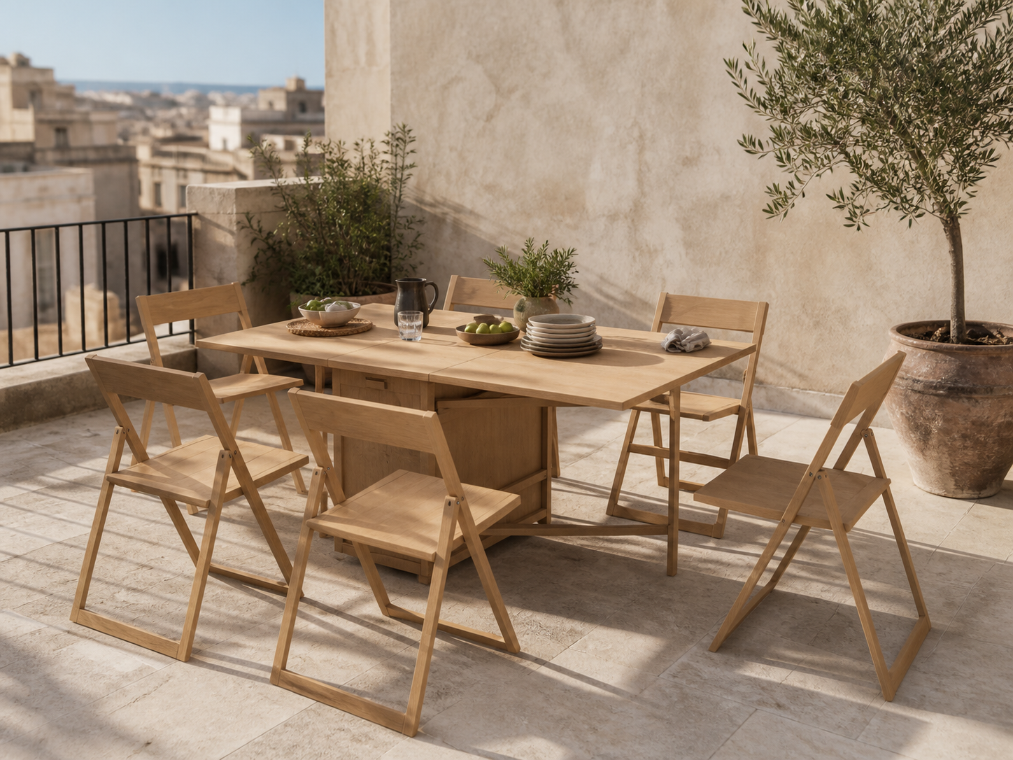 Illustrative light teak foldable dining setting on a Mediterranean terrace